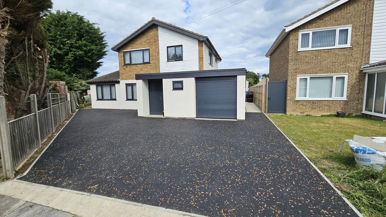 Tarmac driveway with buff chippings, front view