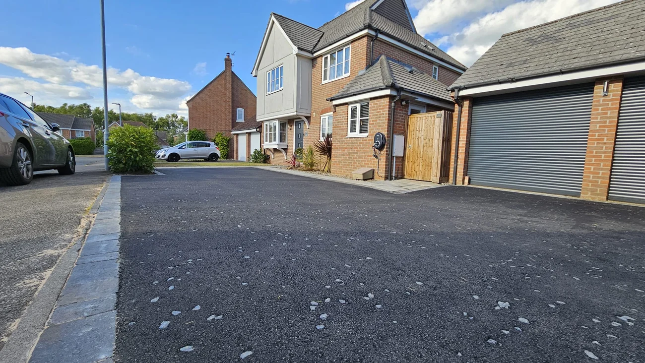 Close-up of tarmac driveway with grey chippings