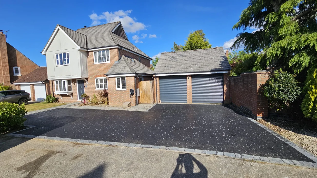 Tarmac driveway to a twin garage