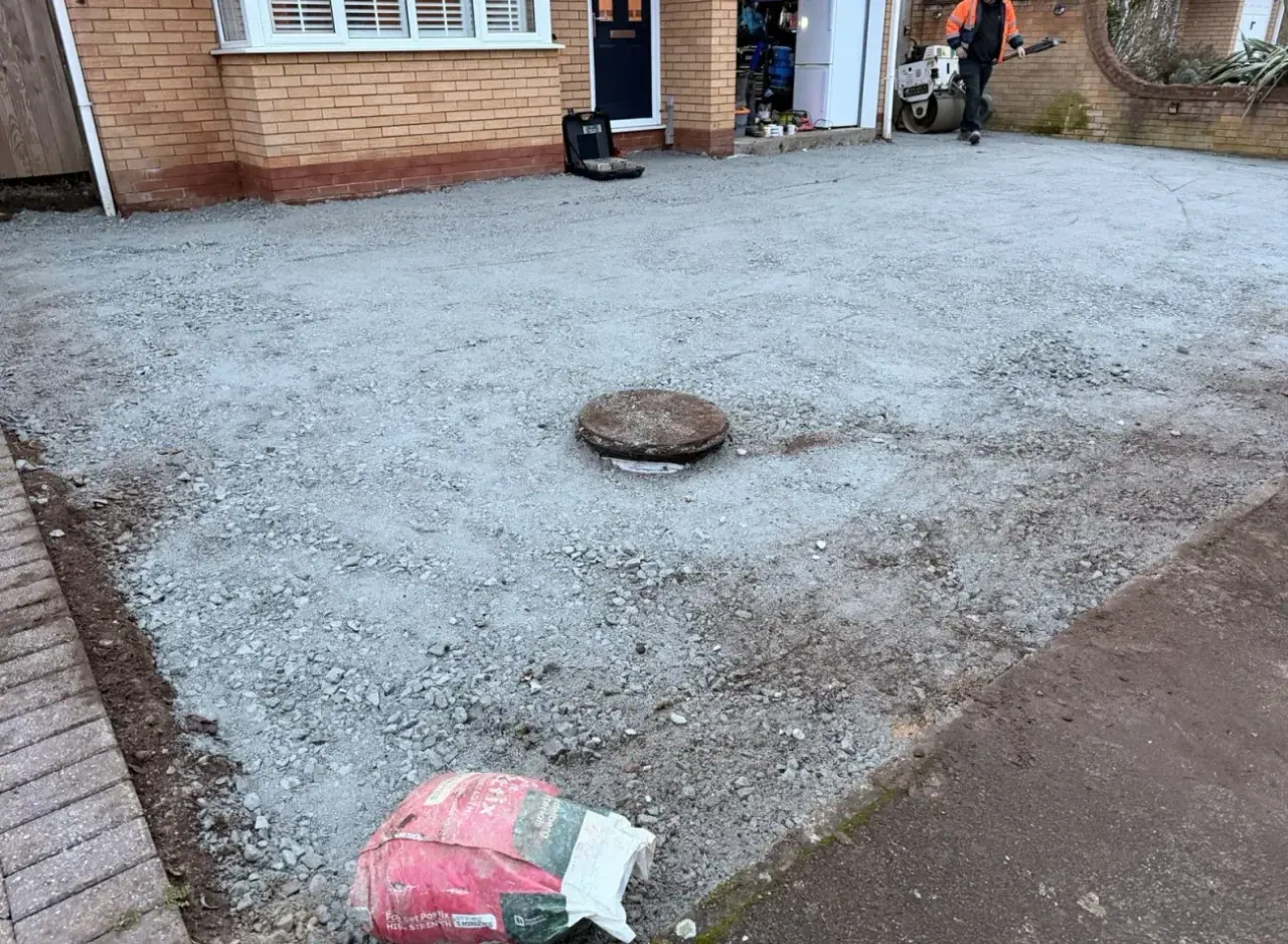 Compacted Type 1 sub-base raked level before a driveway surface is laid