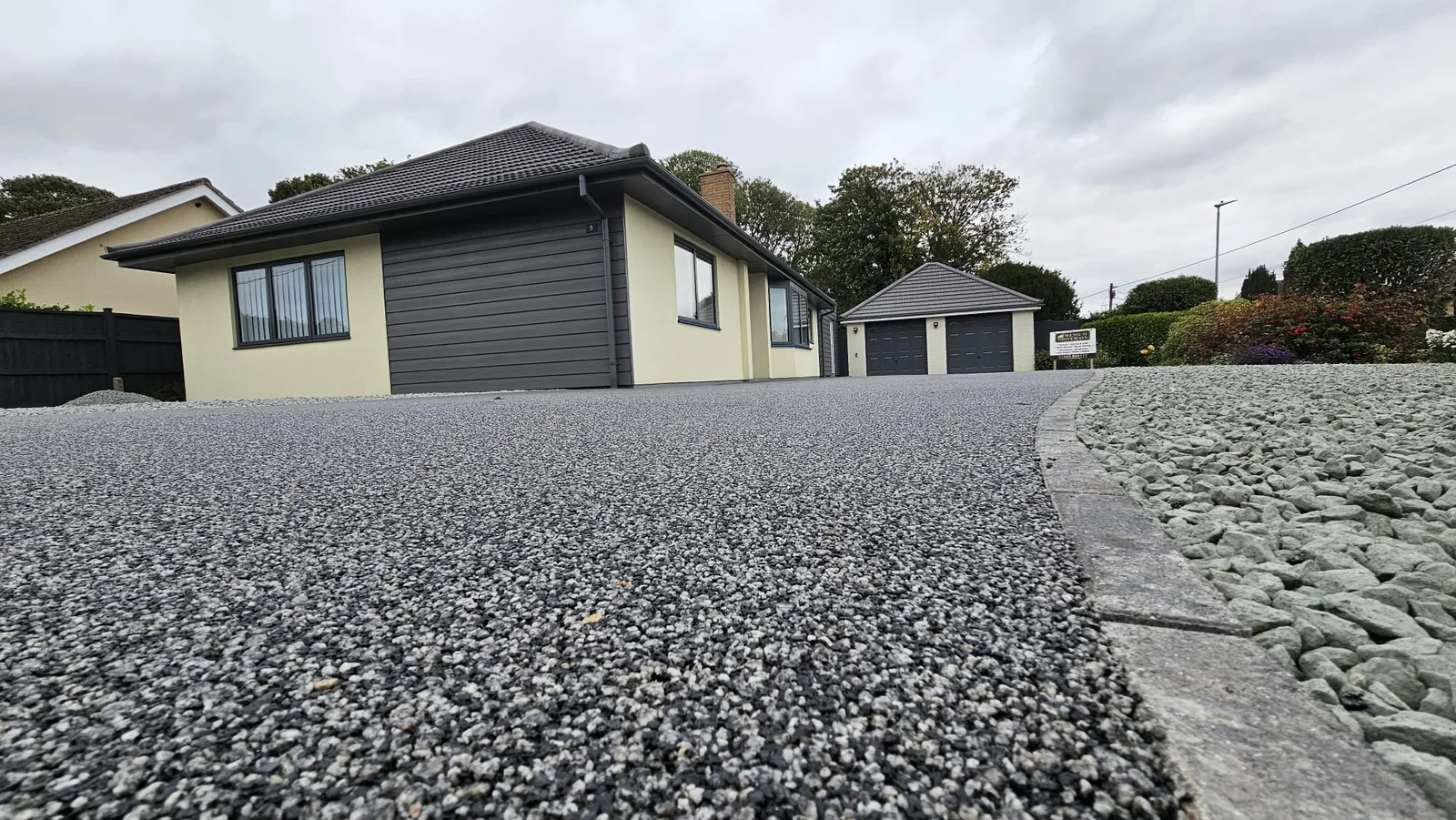 Close-up of a freshly finished silver-grey resin driveway