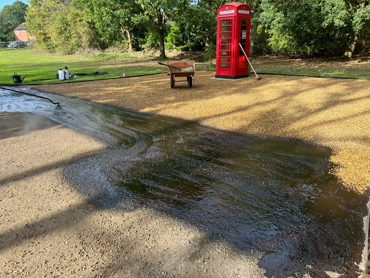 Hot binder and stone chippings going down on a dry autumn day