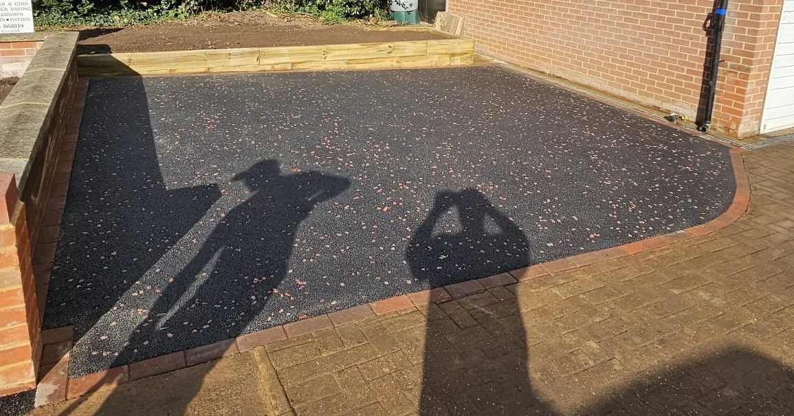 Tarmac driveway with a red border